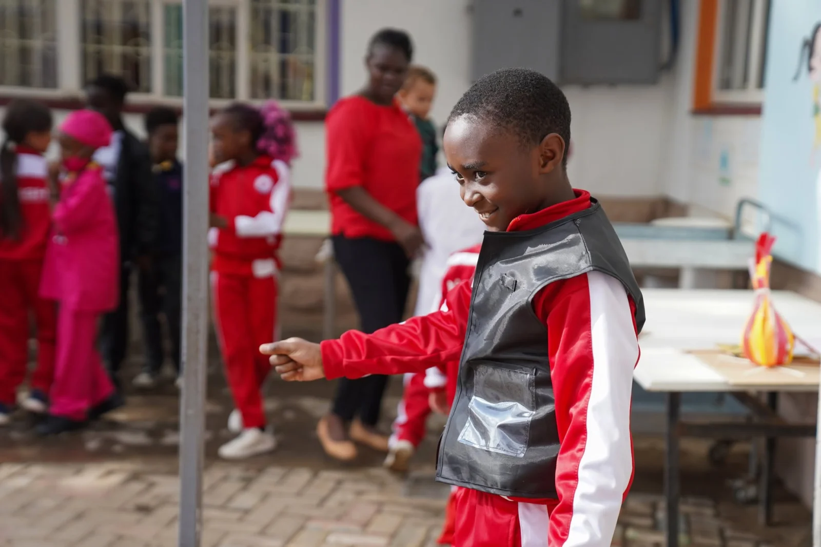 A learner in a safety vest during the fire safety skits