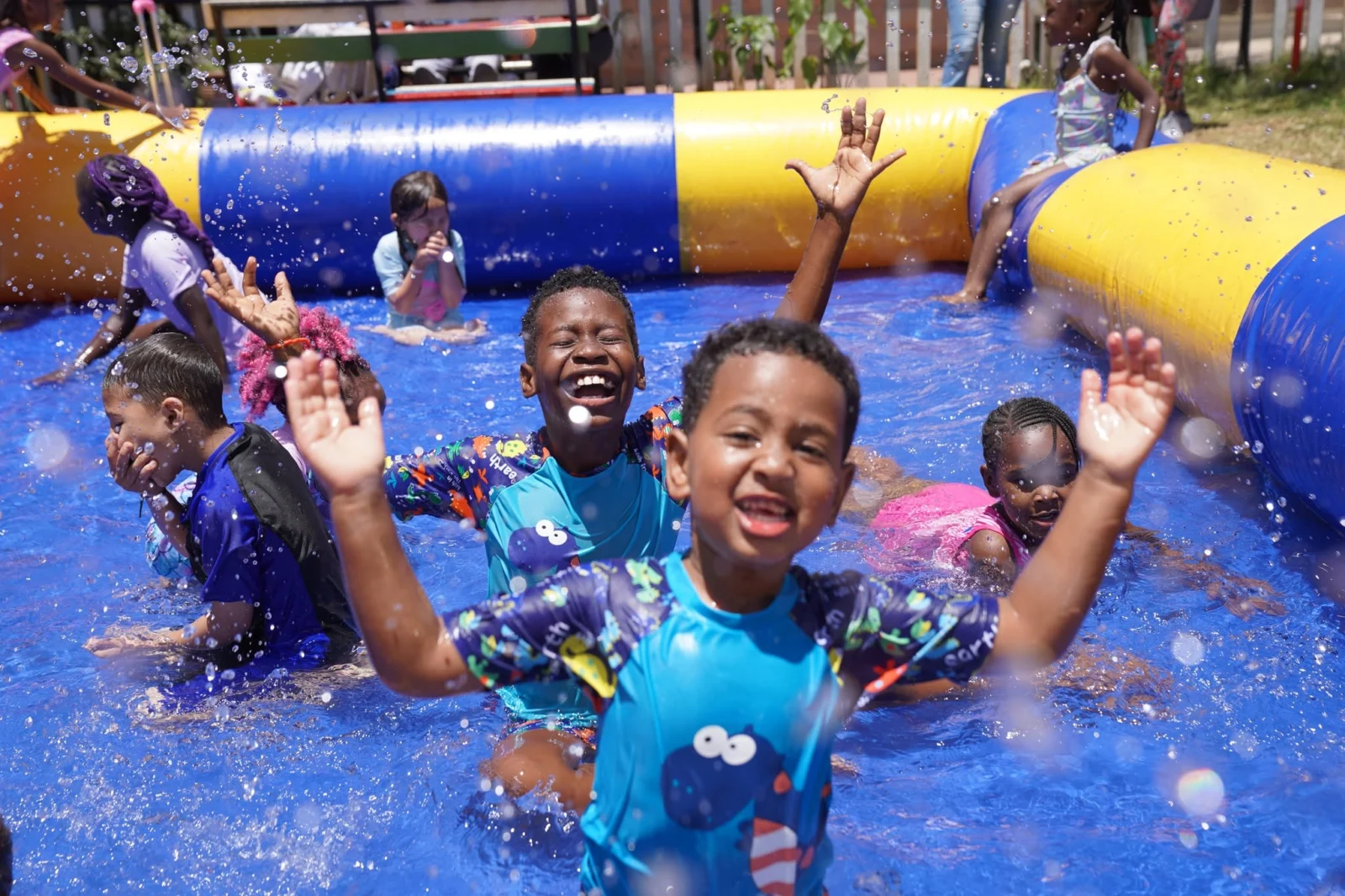 Learners splashing in the pool at the LIS Lenana Fun Day