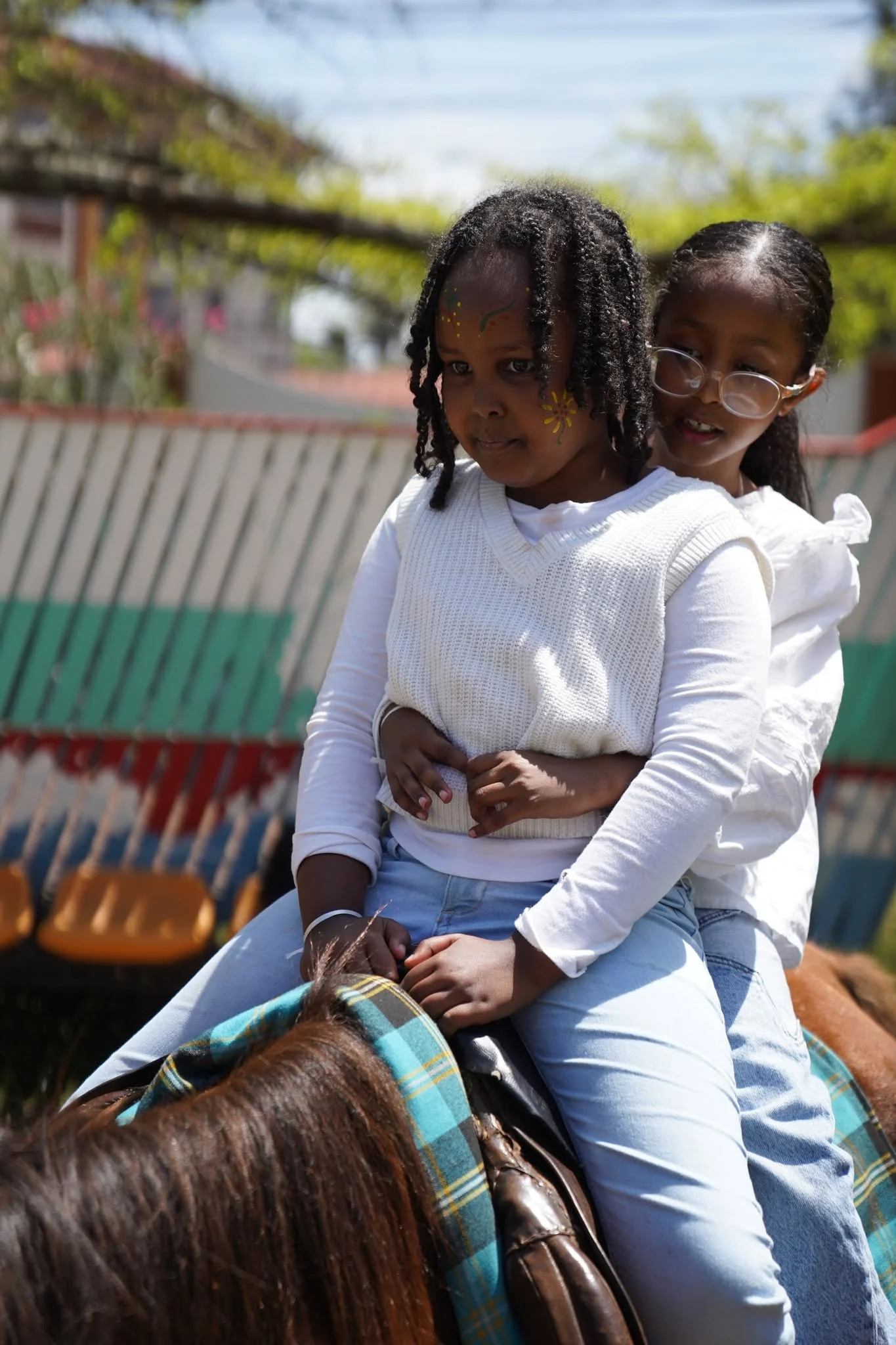 Two learners enjoying a horse ride